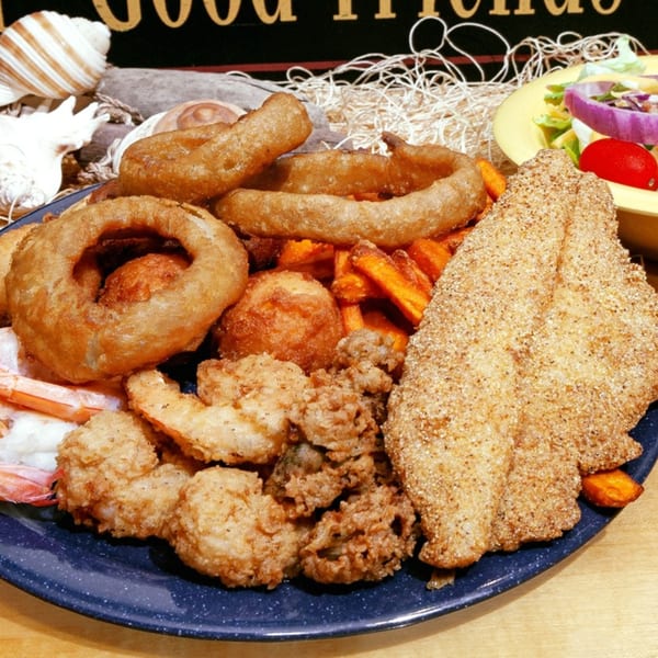 David's Catfish House platter with fried catfish, shrimp, oysters, onion rings, and sweet potato fries.
